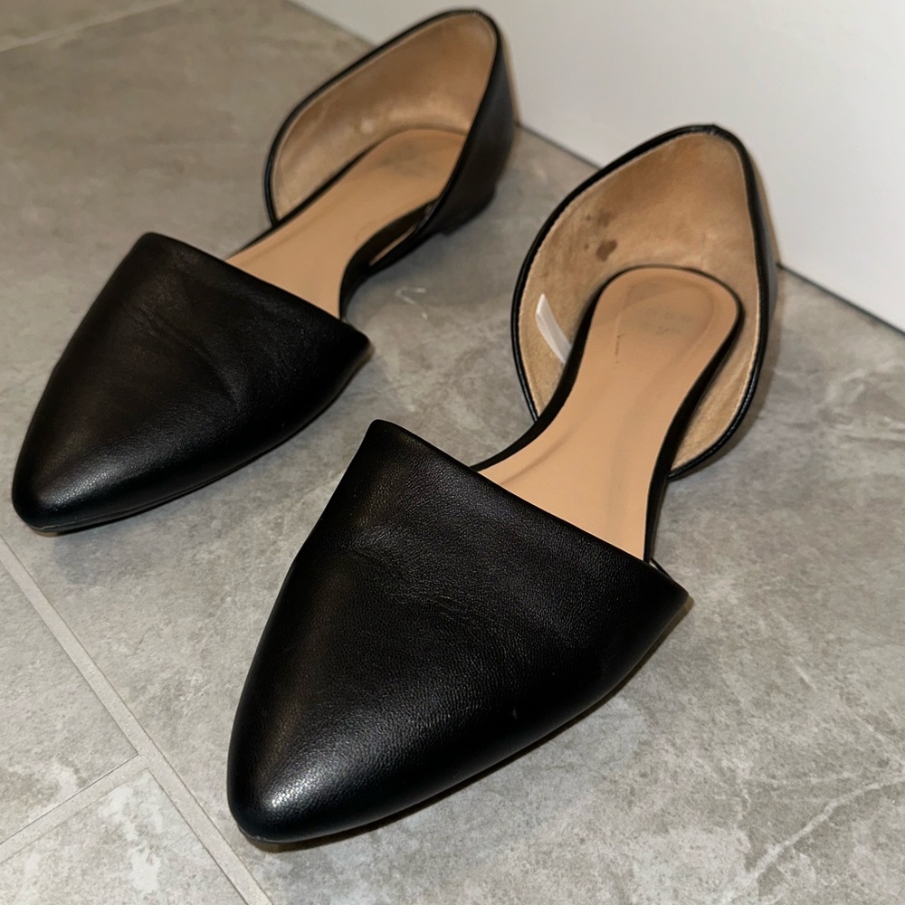 Ballet flat with pointed shoe, worn once with tread on the sole. Size 6.5